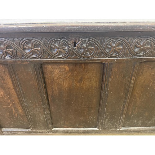 863 - A carved oak coffer, 108 cm wide