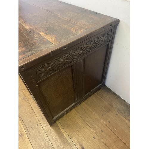 863 - A carved oak coffer, 108 cm wide