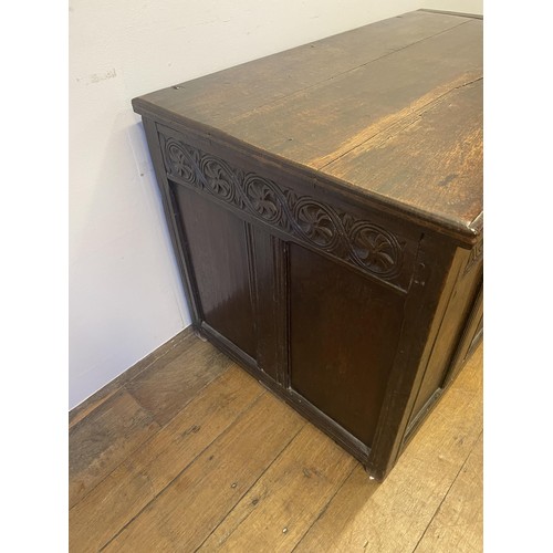 863 - A carved oak coffer, 108 cm wide