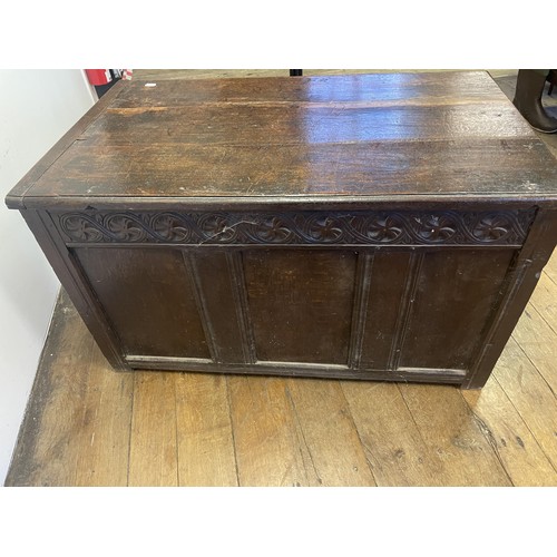 863 - A carved oak coffer, 108 cm wide