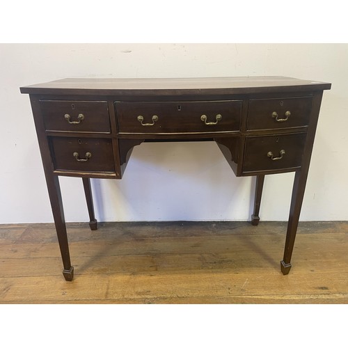 882 - A mahogany bow front sideboard, 107 cm wide, a washstand, and an open bookcase, 64 cm wide (3)