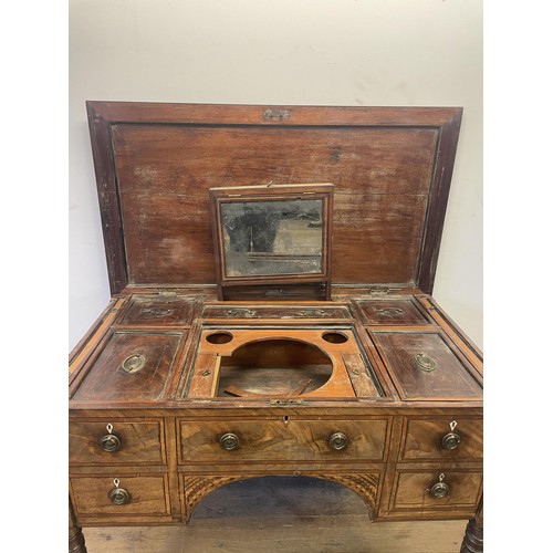 876 - A 19th century mahogany enclosed dressing table, the hinged top to reveal a fitted interior, to incl... 