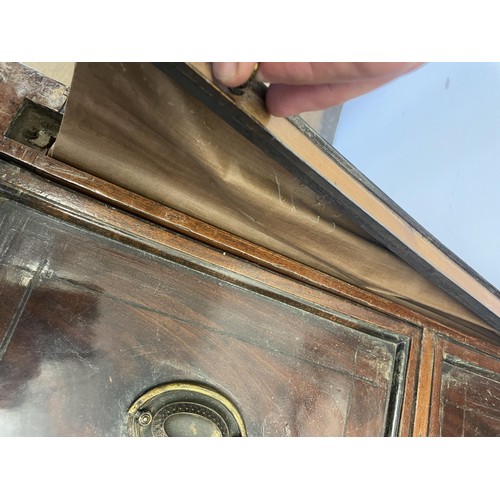 876 - A 19th century mahogany enclosed dressing table, the hinged top to reveal a fitted interior, to incl... 