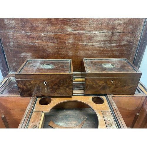 876 - A 19th century mahogany enclosed dressing table, the hinged top to reveal a fitted interior, to incl... 