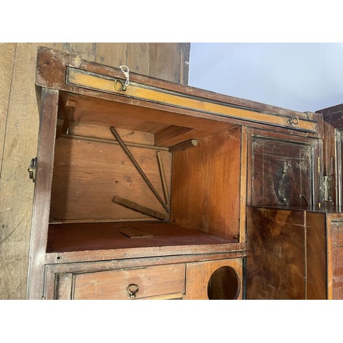 876 - A 19th century mahogany enclosed dressing table, the hinged top to reveal a fitted interior, to incl... 