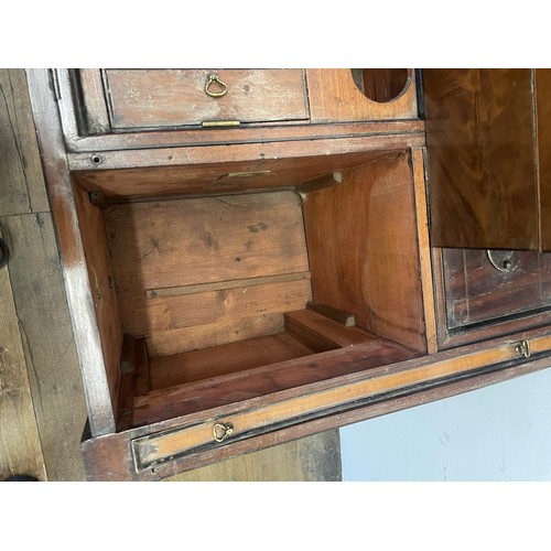 876 - A 19th century mahogany enclosed dressing table, the hinged top to reveal a fitted interior, to incl... 