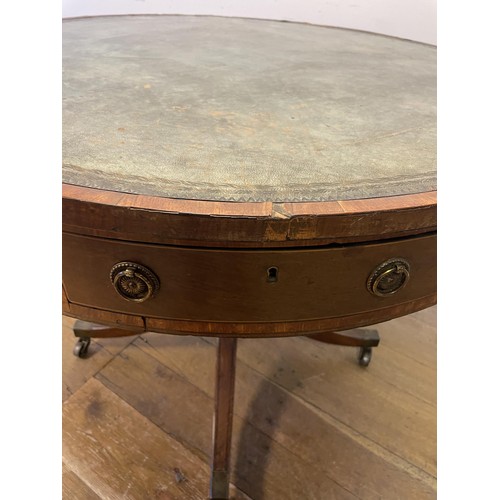 847 - A 19th century mahogany drum table, with a tooled and gilt leather inset top, having four frieze dra... 