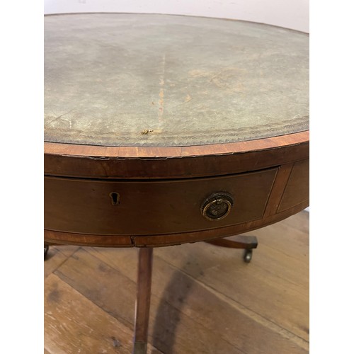 847 - A 19th century mahogany drum table, with a tooled and gilt leather inset top, having four frieze dra... 