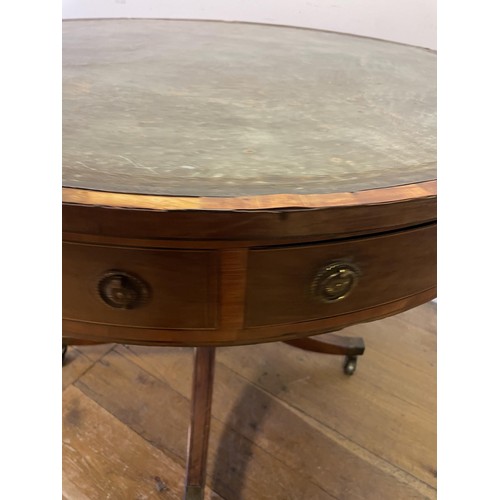 847 - A 19th century mahogany drum table, with a tooled and gilt leather inset top, having four frieze dra... 