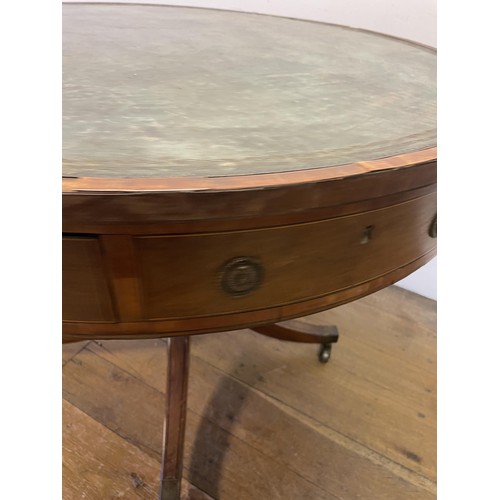 847 - A 19th century mahogany drum table, with a tooled and gilt leather inset top, having four frieze dra... 