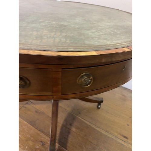 847 - A 19th century mahogany drum table, with a tooled and gilt leather inset top, having four frieze dra... 