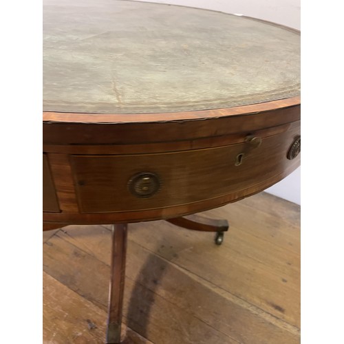 847 - A 19th century mahogany drum table, with a tooled and gilt leather inset top, having four frieze dra... 