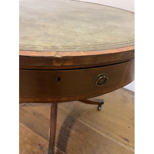 847 - A 19th century mahogany drum table, with a tooled and gilt leather inset top, having four frieze dra... 