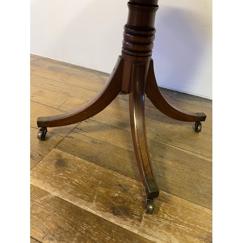 847 - A 19th century mahogany drum table, with a tooled and gilt leather inset top, having four frieze dra... 