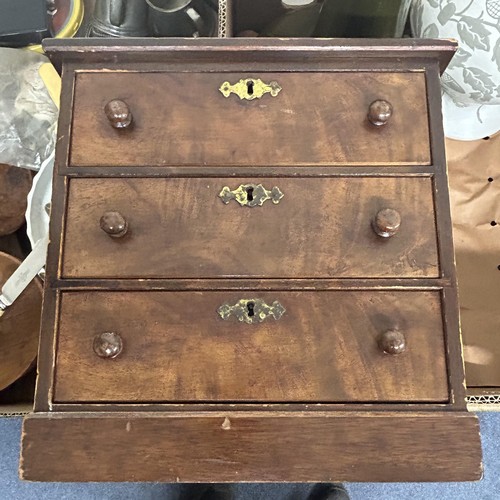 716 - A mahogany table top chest, of three drawers, 28 cm wide, treen bowls and assorted other items (2 bo... 