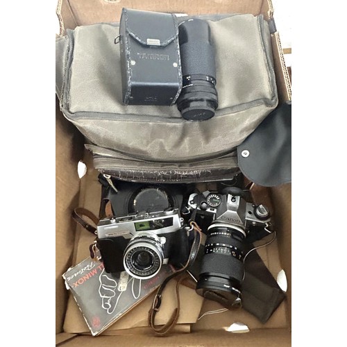 717 - A Canon AE-1 camera, an Olympus lens, a Minox spy type camera, and assorted other photography items ... 