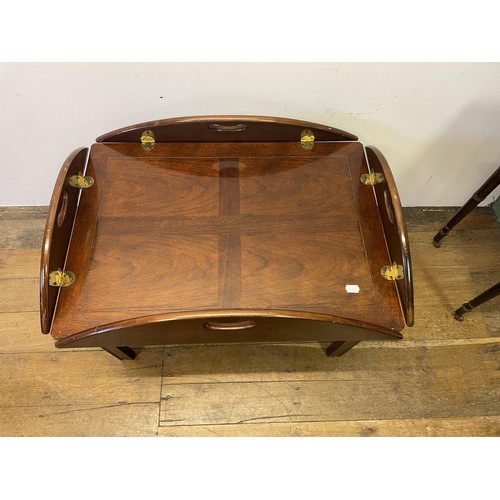 852 - A butler's mahogany tray, on a stand, 82 cm wide