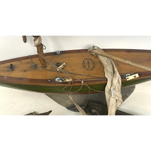 724 - An early 20th century pond yacht, a Chinese silver plated box, decorated dragon, and assorted metalw... 