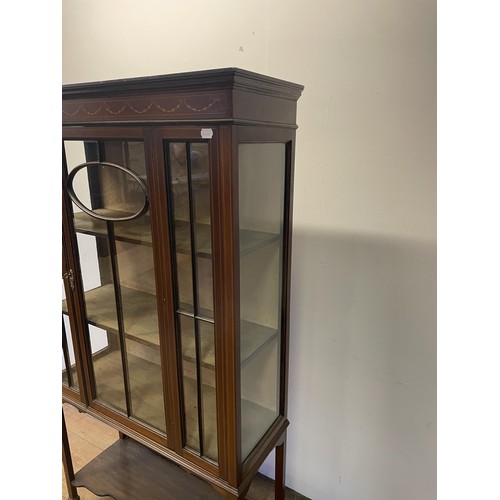 841 - An early 20th century mahogany display cabinet, 90 cm wide