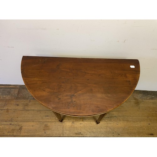 849 - A mahogany demi-lune folding tea table, 87 cm wide