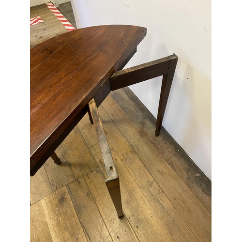 849 - A mahogany demi-lune folding tea table, 87 cm wide