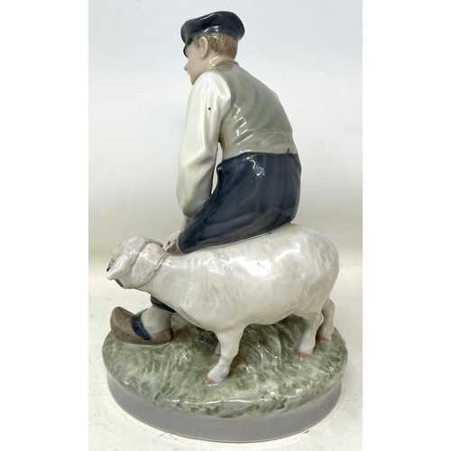 739 - A Royal Copenhagen figure of a man with two sheep, 20 cm high