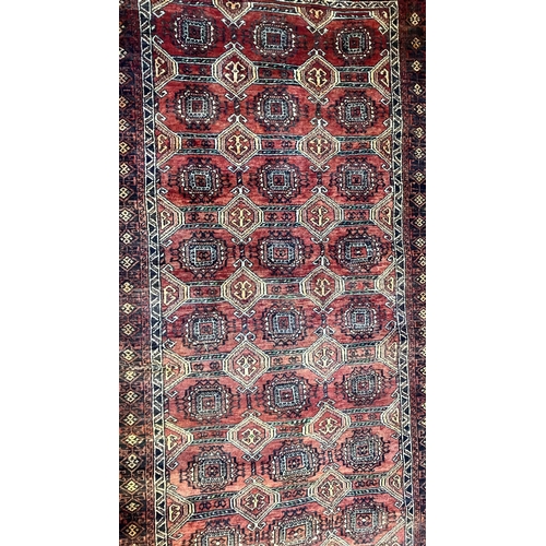 963 - A red ground rug, 190 x 112cm