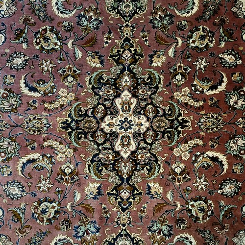 964 - A Persian Qum silk pink ground rug, 205 x 132 cm