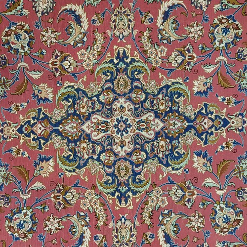 964 - A Persian Qum silk pink ground rug, 205 x 132 cm