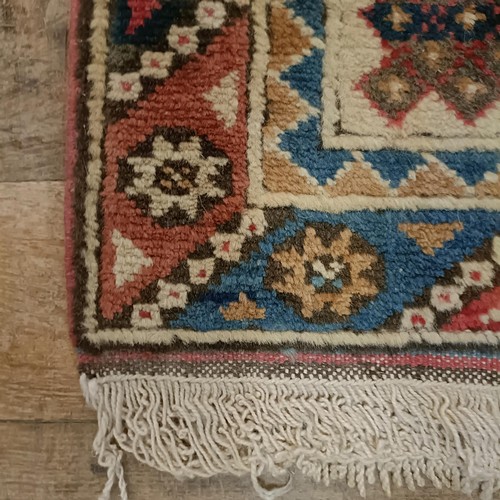 965 - A red ground runner, 275 x 75 cm, and a cream ground runner, 300 x 70 cm (2)