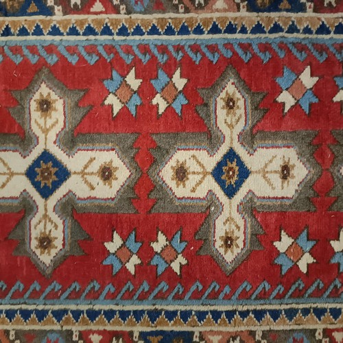 965 - A red ground runner, 275 x 75 cm, and a cream ground runner, 300 x 70 cm (2)