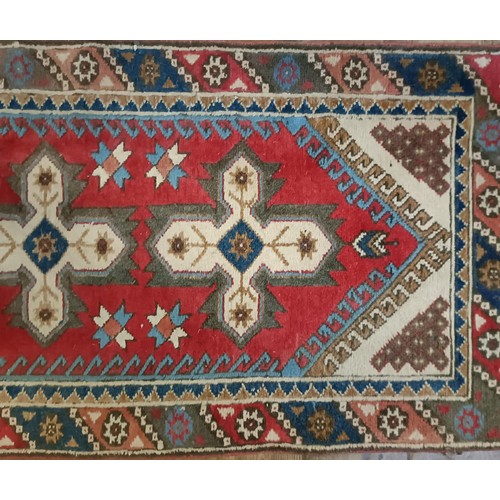 965 - A red ground runner, 275 x 75 cm, and a cream ground runner, 300 x 70 cm (2)