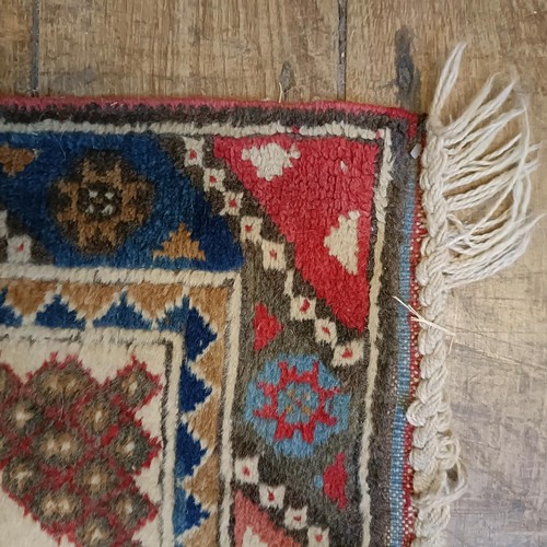 965 - A red ground runner, 275 x 75 cm, and a cream ground runner, 300 x 70 cm (2)