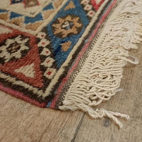 965 - A red ground runner, 275 x 75 cm, and a cream ground runner, 300 x 70 cm (2)