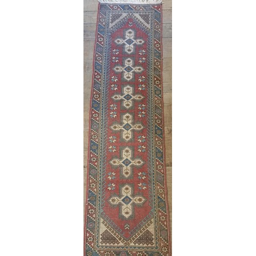 965 - A red ground runner, 275 x 75 cm, and a cream ground runner, 300 x 70 cm (2)