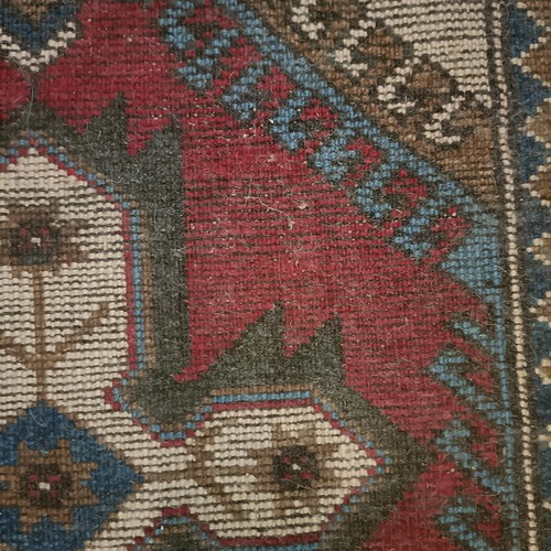 965 - A red ground runner, 275 x 75 cm, and a cream ground runner, 300 x 70 cm (2)