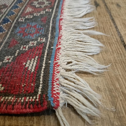 965 - A red ground runner, 275 x 75 cm, and a cream ground runner, 300 x 70 cm (2)