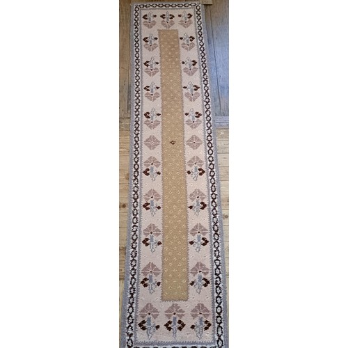 965 - A red ground runner, 275 x 75 cm, and a cream ground runner, 300 x 70 cm (2)