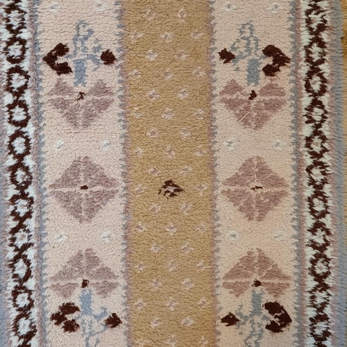 965 - A red ground runner, 275 x 75 cm, and a cream ground runner, 300 x 70 cm (2)