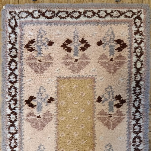 965 - A red ground runner, 275 x 75 cm, and a cream ground runner, 300 x 70 cm (2)