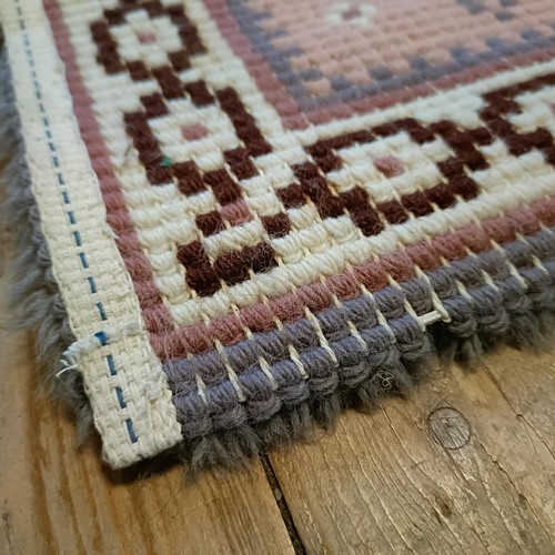 965 - A red ground runner, 275 x 75 cm, and a cream ground runner, 300 x 70 cm (2)