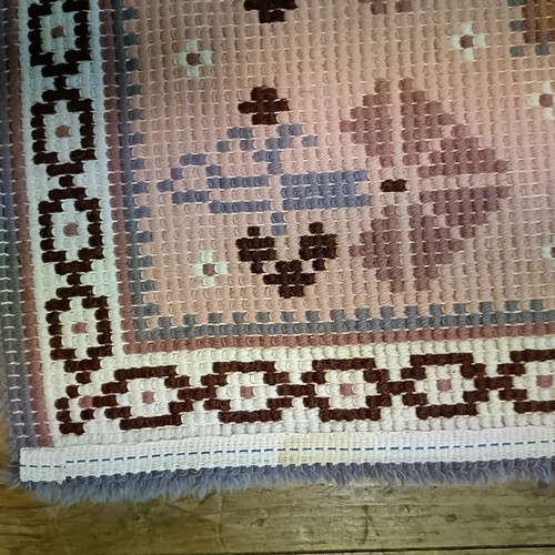 965 - A red ground runner, 275 x 75 cm, and a cream ground runner, 300 x 70 cm (2)