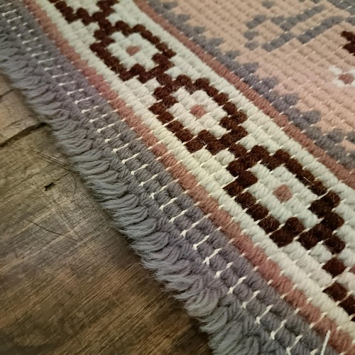 965 - A red ground runner, 275 x 75 cm, and a cream ground runner, 300 x 70 cm (2)