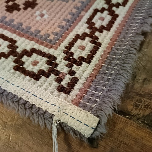 965 - A red ground runner, 275 x 75 cm, and a cream ground runner, 300 x 70 cm (2)