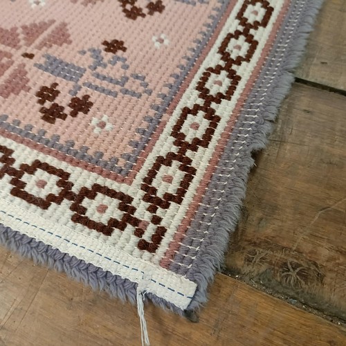 965 - A red ground runner, 275 x 75 cm, and a cream ground runner, 300 x 70 cm (2)