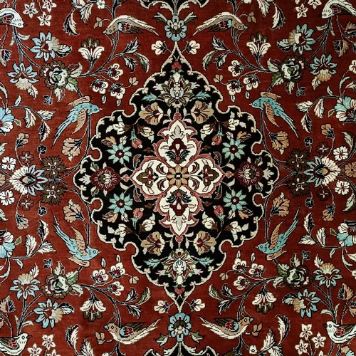 966 - A Persian Qum silk red ground rug, 150 x 100 cm