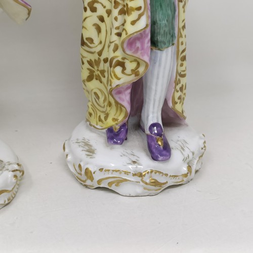 793 - A Dresden figure of a doctor, 18 cm high, and his patient, 17 cm high (2)