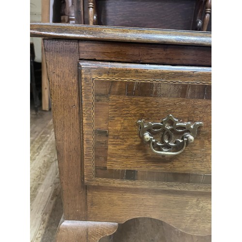 898 - An oak dresser, having a three tier plate rack, on a base with three drawers, on cabriole legs to pa... 