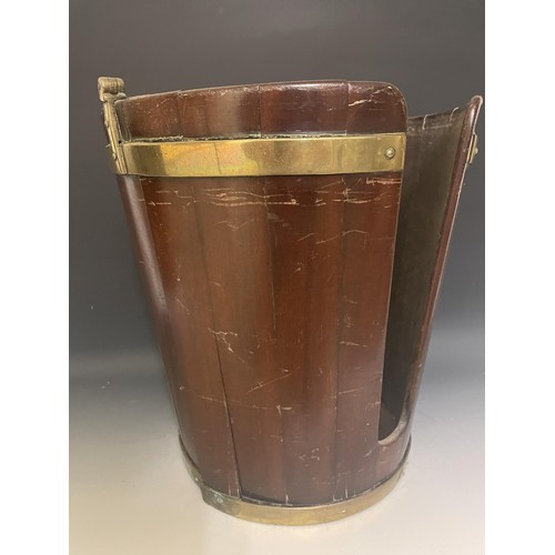 895 - A 19th century mahogany and brass bound plate bucket, with a swing handle, 30 cm diameter