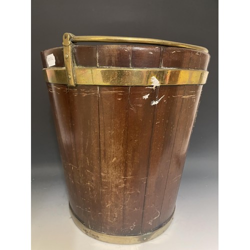 895 - A 19th century mahogany and brass bound plate bucket, with a swing handle, 30 cm diameter